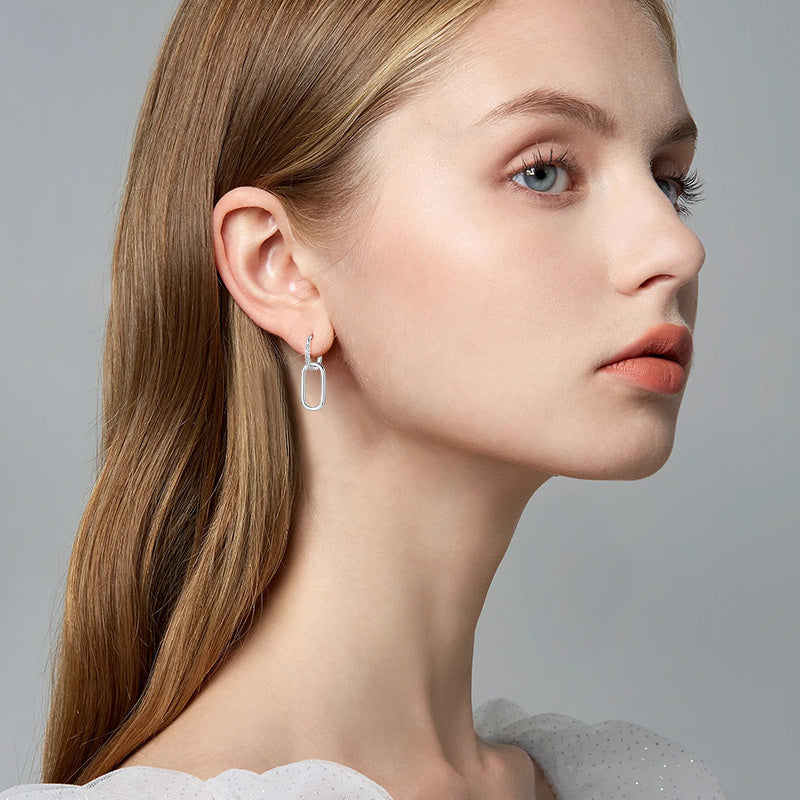 Detailed shot of the inner comfort fit of huggie hoop earrings
