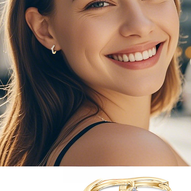 Minimalist gold hoop earring close up