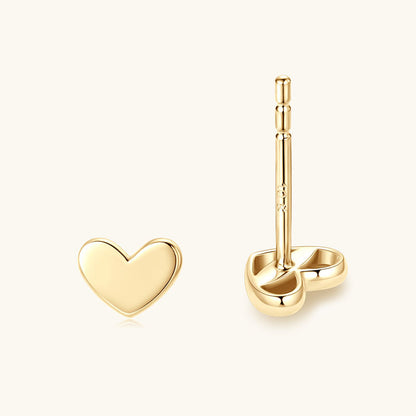 Lifestyle shot of 10K gold minimalist stud earrings being worn