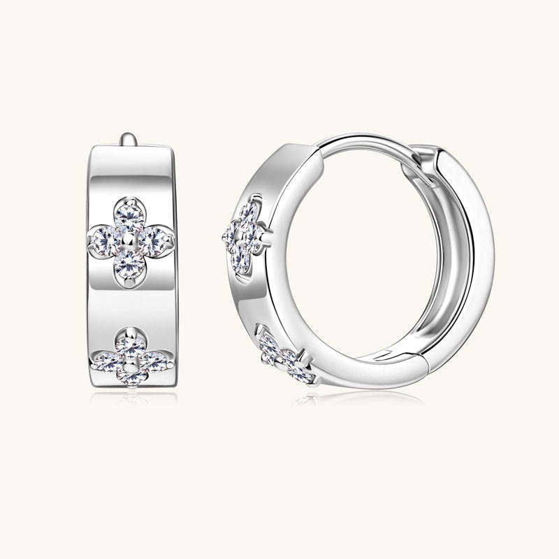 Close up detail of 14K gold huggie hoop earrings showing premium finish and secure clasp mechanism