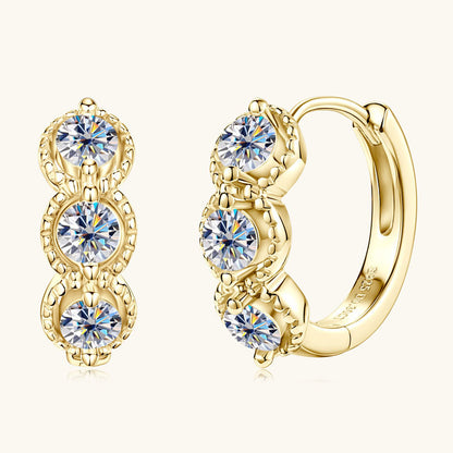 14K gold huggie hoop earrings front view showing circular design and polished finish