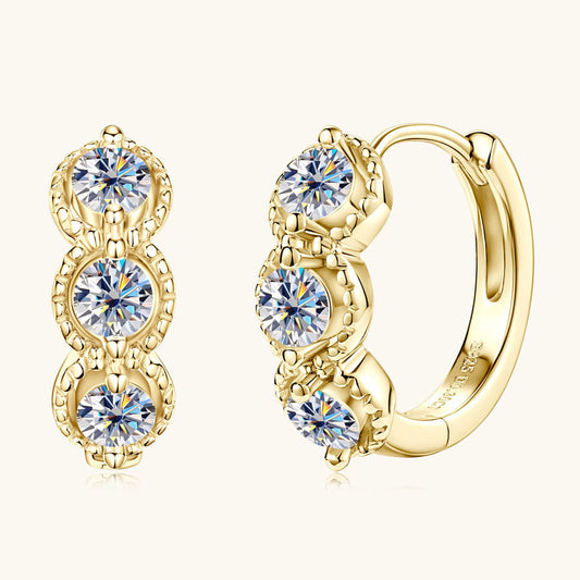 14K gold huggie hoop earrings front view showing circular design and polished finish