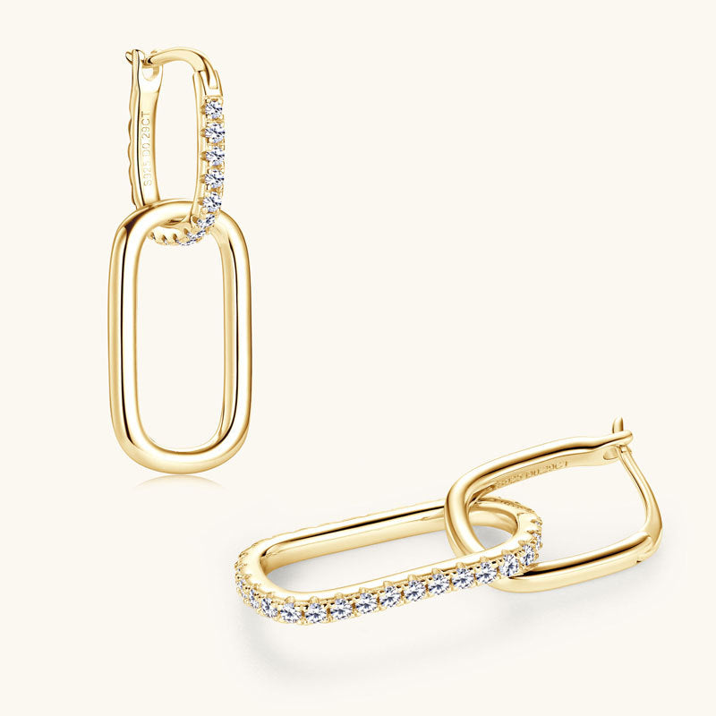 Professional woman wearing 14K gold stud earrings