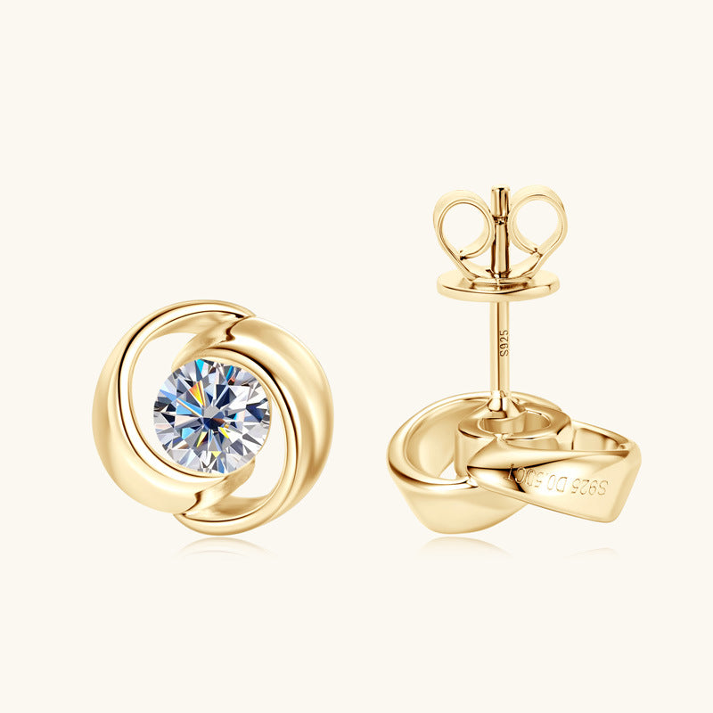 Sterling silver flower stud earring with moissanite center on white background