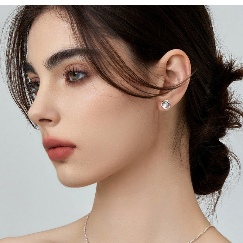 Minimalist silver flower earring with clear moissanite set in spiral design