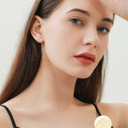 Side view of Luckinging Cross Stud Earrings highlighting design details