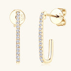 Gold dangle earrings with moissanite stones