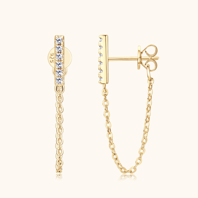 Close-up of silver moissanite dangle earrings showing stone and chain