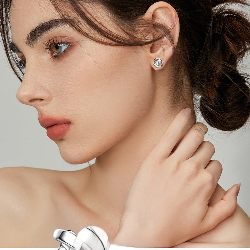 Side view of 925 silver flower stud earring with round moissanite gem