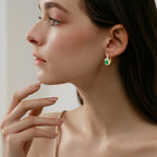 Image showing how huggie earrings hug the earlobe