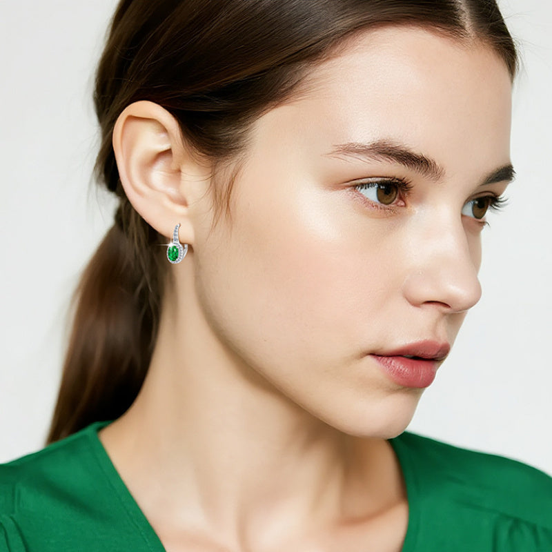 Side profile of sterling silver huggie earrings showing fit