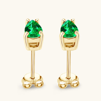 High quality emerald gemstones in gold hoop setting
