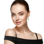 Side view of lightweight emerald dangle earrings