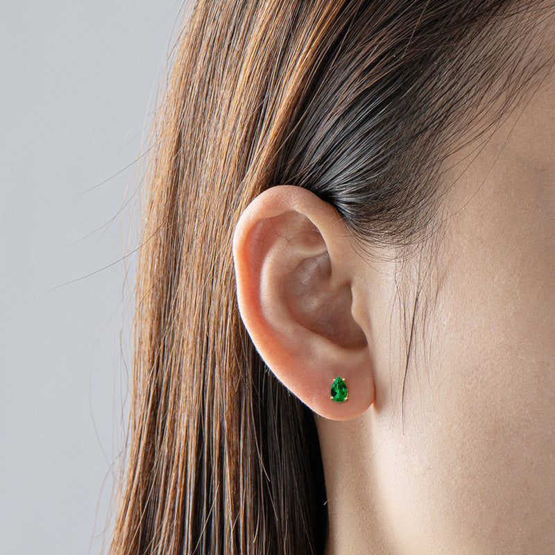 Side view of drop earrings with star-shaped cubic zirconia