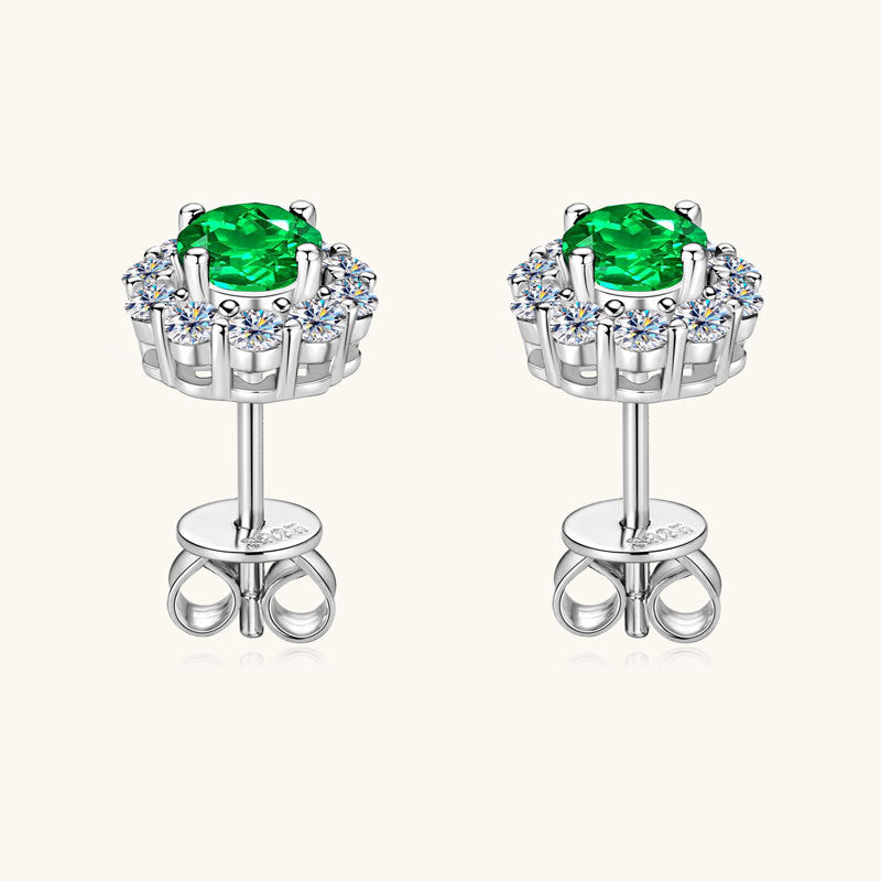 Profile view of flat back silver stud earring with emerald stone