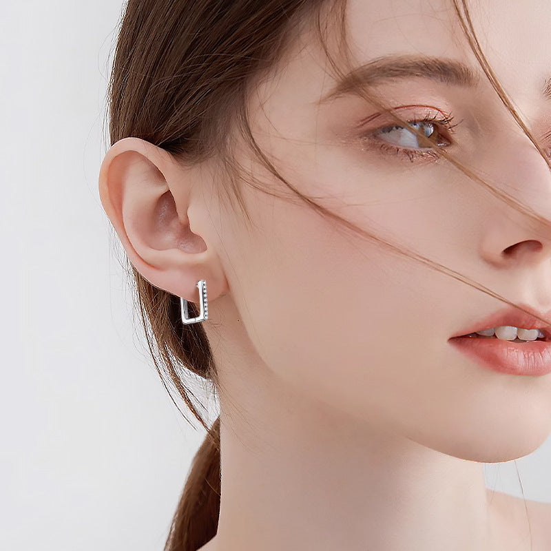 Simple stud earrings in modern setting