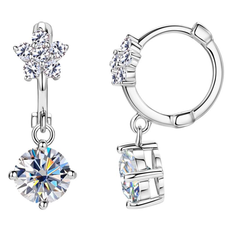Delicate flower dangle earring on white background