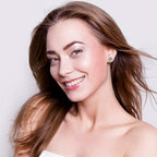 Pair of flower stud earrings with different moissanite sizes