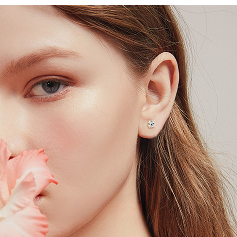 Elegant gold flower stud earring isolated