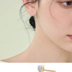 Gold heart stud earrings featuring three Moissanite stones
