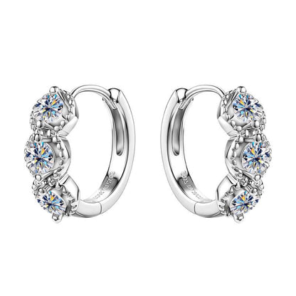 Gold huggie earrings clasp mechanism showing secure closure and comfort design