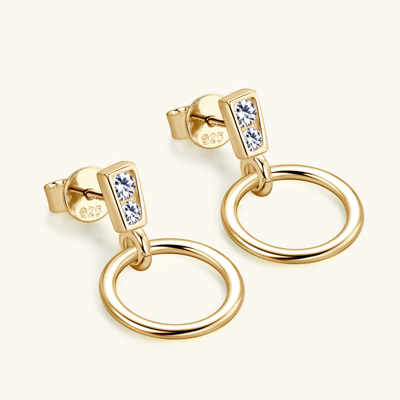 Front view of 14K gold dangle earrings with moissanite stones