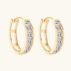 Gold hoop earrings styled casually on a woman