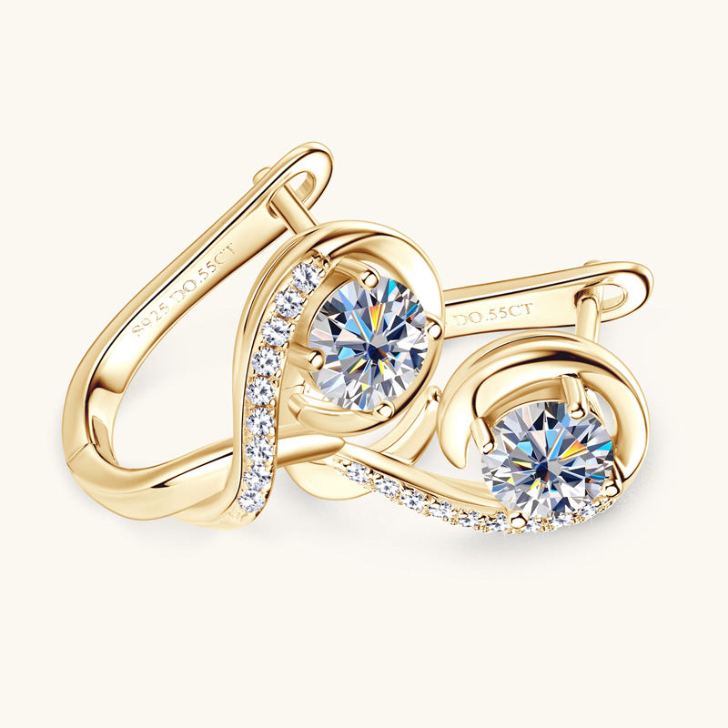 Woman wearing gold plated huggie hoop earrings professional style
