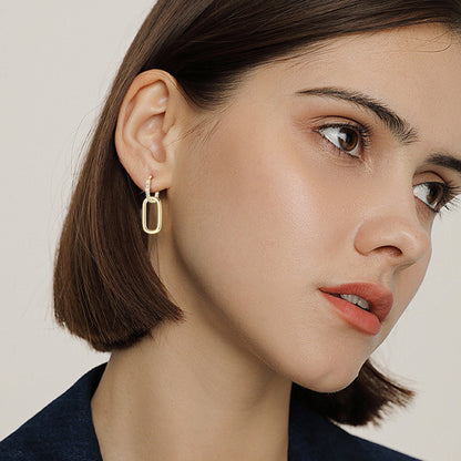Close up detail of gold stud earrings showing craftsmanship