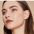 Gold flat back stud earring with teardrop moissanite gemstone