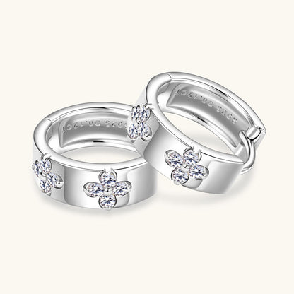 Detailed view of huggie earrings secure clasp design featuring smooth opening and closing mechanism