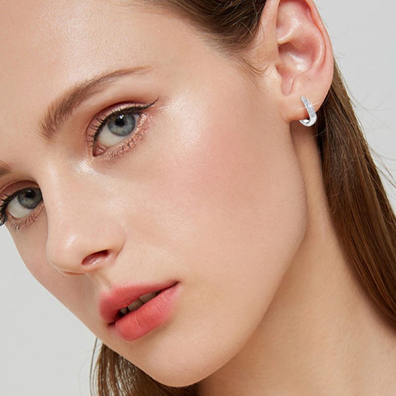 Luxury detailed view of 925 sterling silver huggie earrings