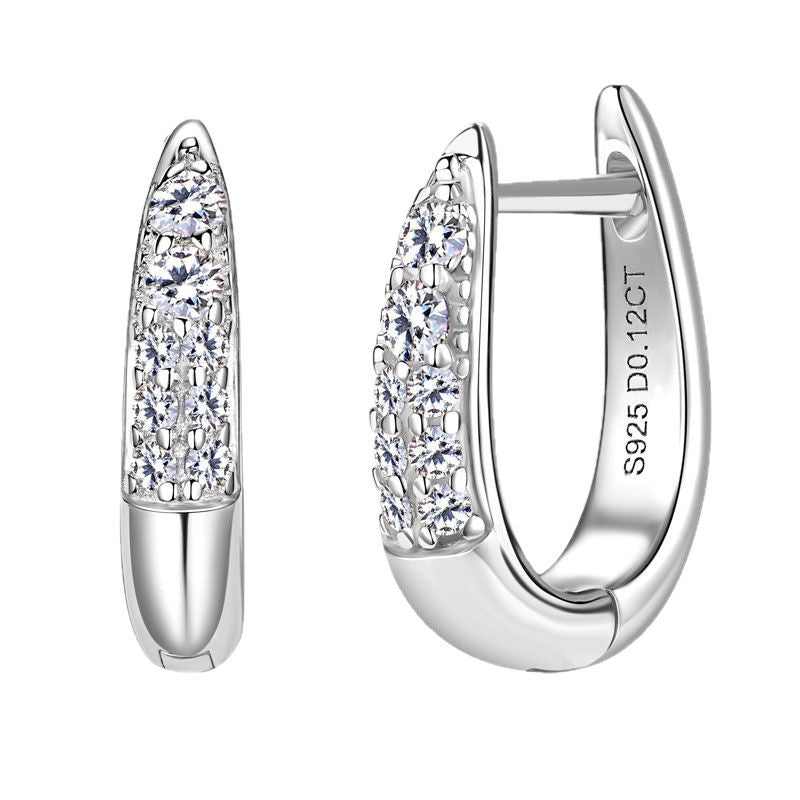 Pair of huggie earrings showing symmetry and fit