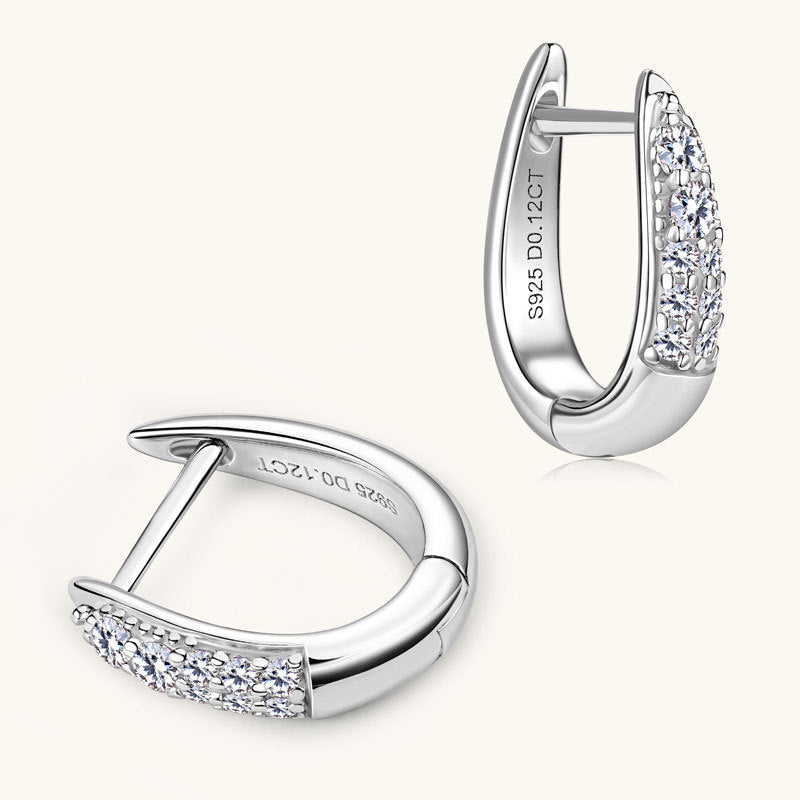 Side angle shot of sterling silver huggie earrings