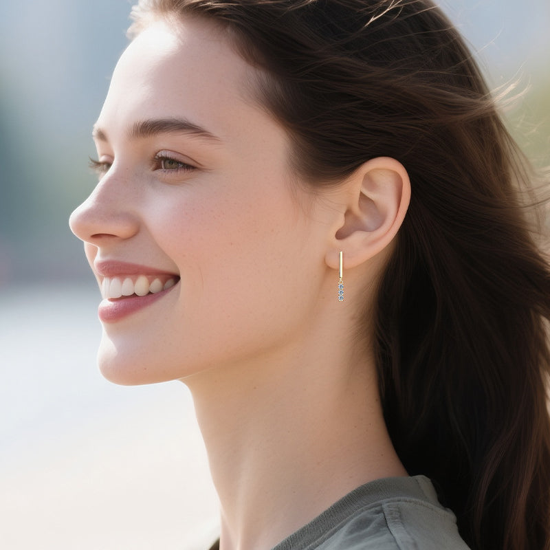 Multiple angle view of huggie hoop earrings showing sterling silver craftsmanship and design
