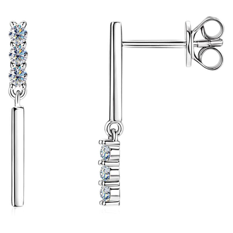 Size comparison guide showing 8mm sterling silver huggie hoop earrings with moissanite stones
