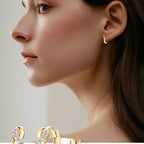 Detail of micro-pave set moissanite stones in huggie frame
