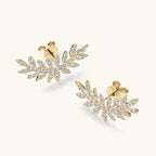 Earrings from above showcasing full leaf pattern with moissanite stones