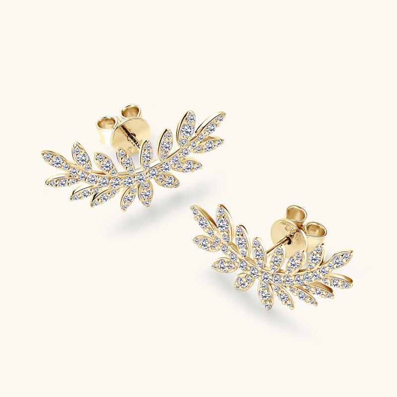 Earrings from above showcasing full leaf pattern with moissanite stones