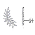Profile view of leaf-shaped moissanite dangle earrings on model ear