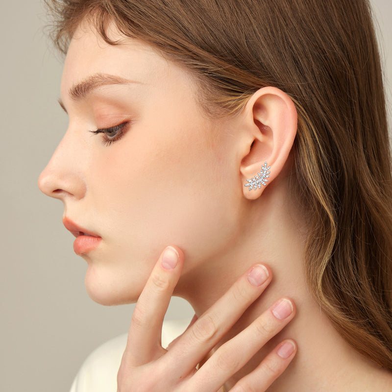 Earrings worn on ear showing how they dangle and catch light