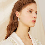 Detail of moissanite stones on Luckinging bow stud earring