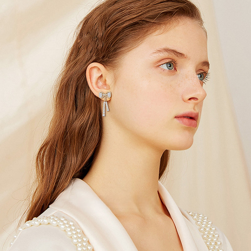 Detail of moissanite stones on Luckinging bow stud earring