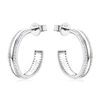 Luckinging dangle earrings worn, showing subtle sparkle