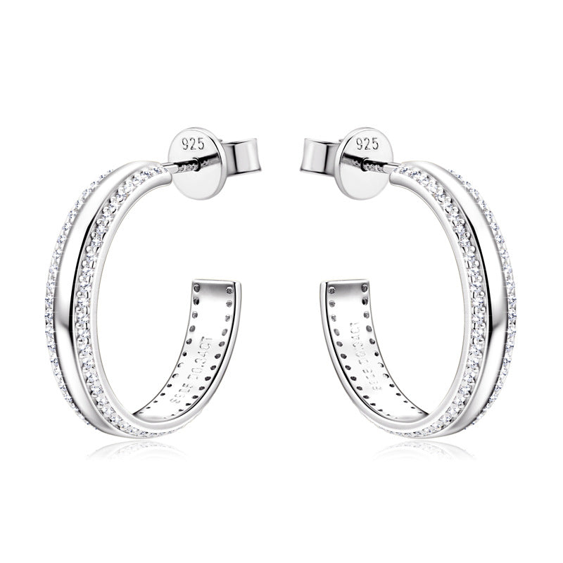 Luckinging dangle earrings worn, showing subtle sparkle