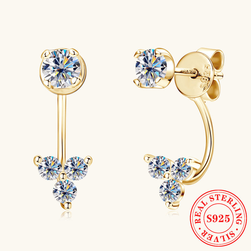 Luckinging C-shaped dangle earrings with moissanite on a model's ear