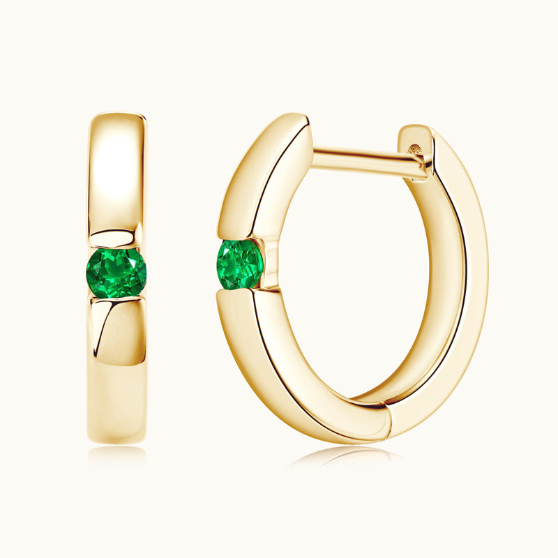 Close-up of Luckinging Sterling Silver Emerald Huggie Earrings showing front detail