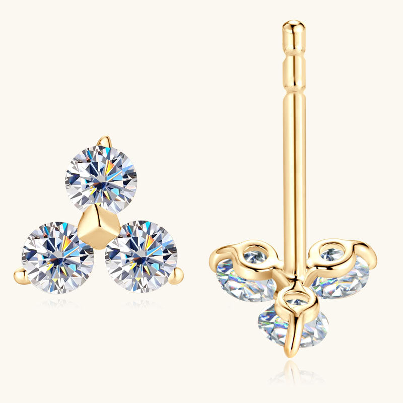 Close-up of gold flower stud earring with moissanite stones