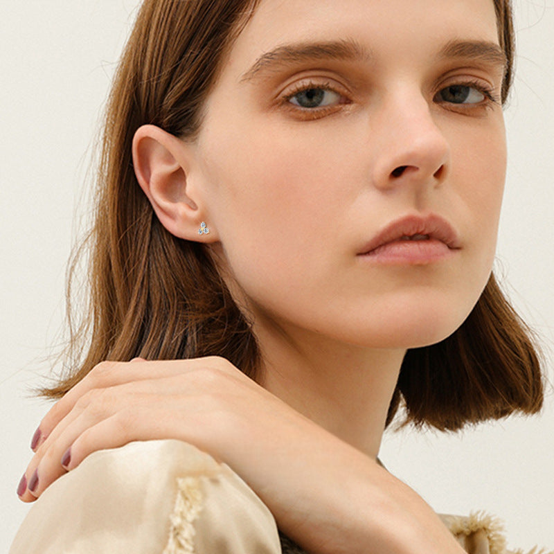Side angle of Luckinging gold flower stud earring