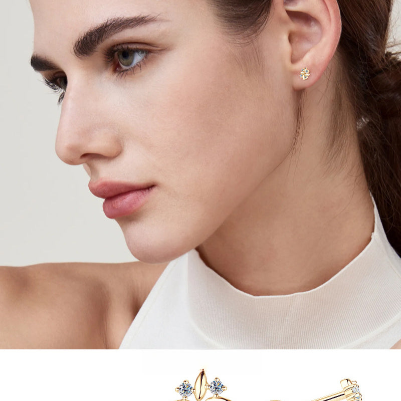 Side view of gold huggie stud with delicate leaf detail